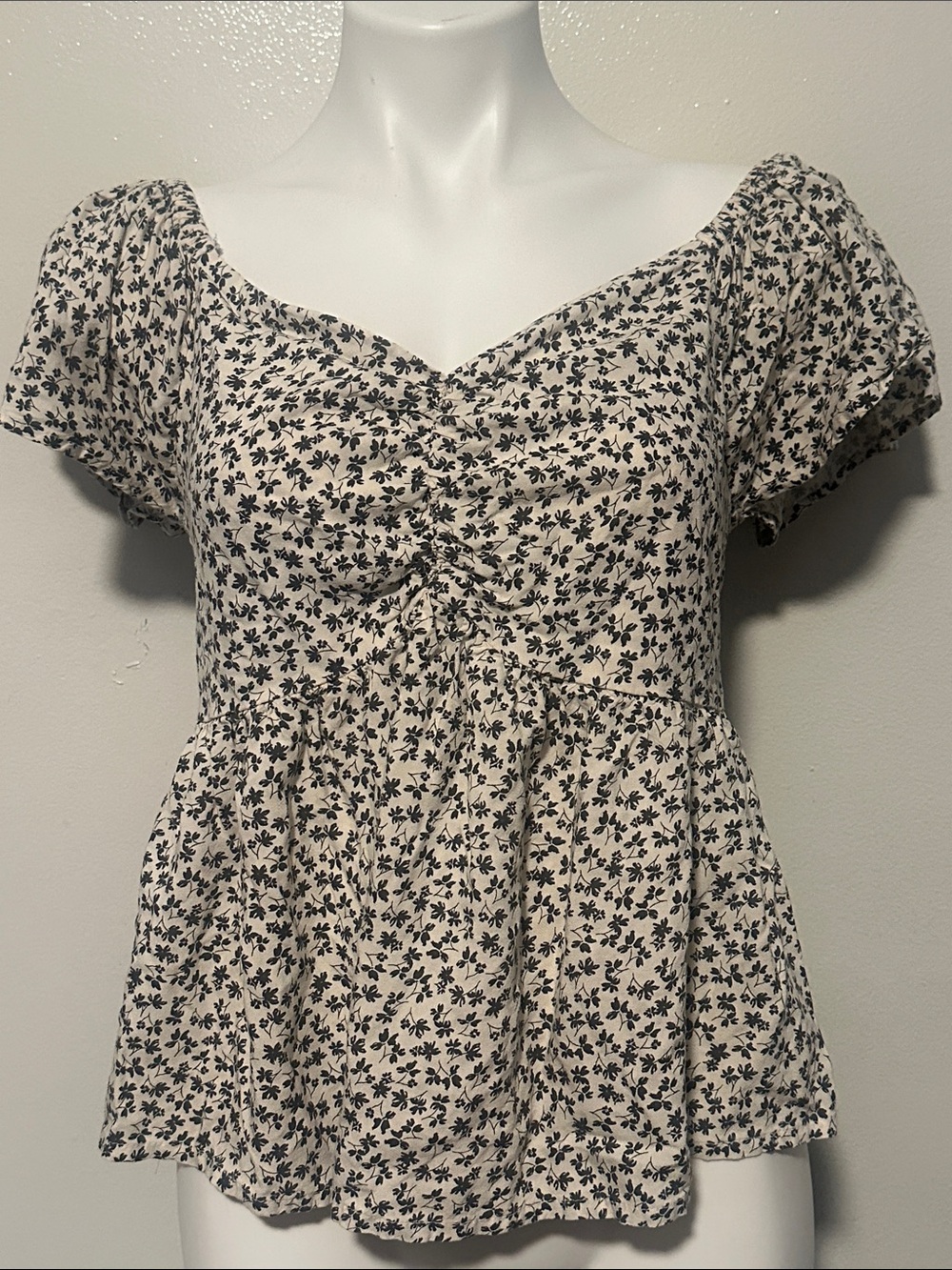 Japna Cream Peplum Top with Black Floral Print